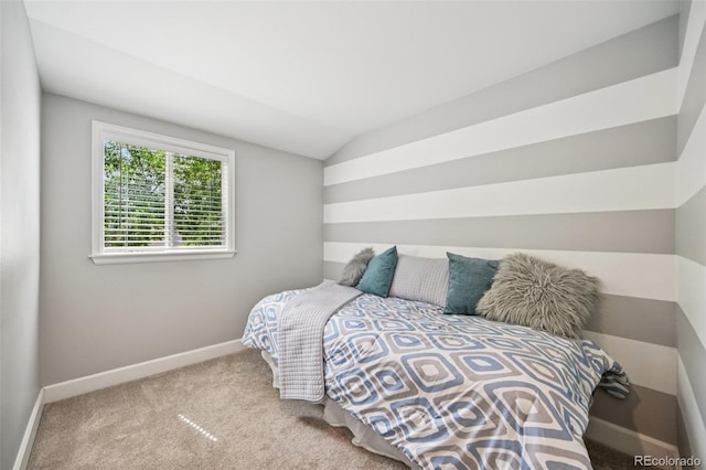 2880 S High St, Denver, CO 80210 - carpeted bedroom with baseboards and vaulted ceiling