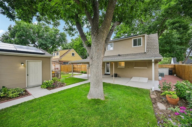 2880 S High St, Denver, CO 80210 - back of house featuring a patio area, a fenced backyard, and brick siding