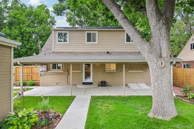 2880 S High St, Denver, CO 80210 - rear view of property featuring a patio, brick siding, and roof with shingles