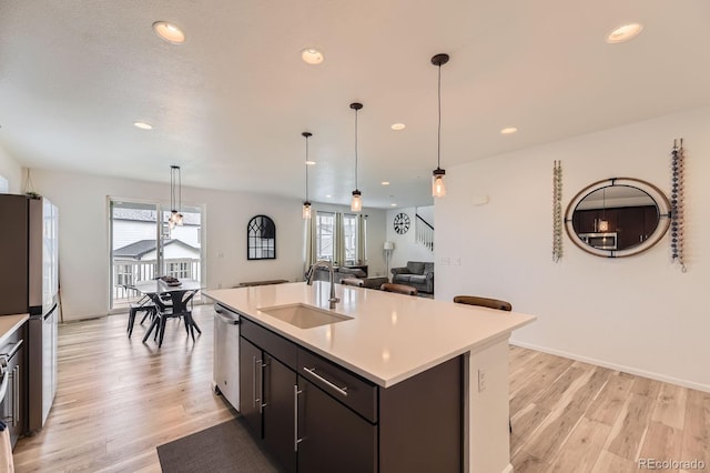 1420 E Witherspoon Dr, Elizabeth, CO 80107 - kitchen with a sink, stainless steel appliances, light countertops, recessed lighting, and light wood finished floors