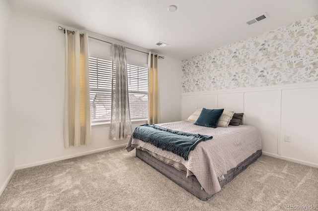 1420 E Witherspoon Dr, Elizabeth, CO 80107 - carpeted bedroom with a wainscoted wall, wallpapered walls, and baseboards