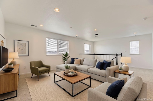 1420 E Witherspoon Dr, Elizabeth, CO 80107 - living area with light carpet, healthy amount of natural light, recessed lighting, and baseboards