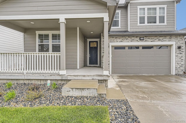 1420 E Witherspoon Dr, Elizabeth, CO 80107 - doorway to property with driveway, a garage, and a porch