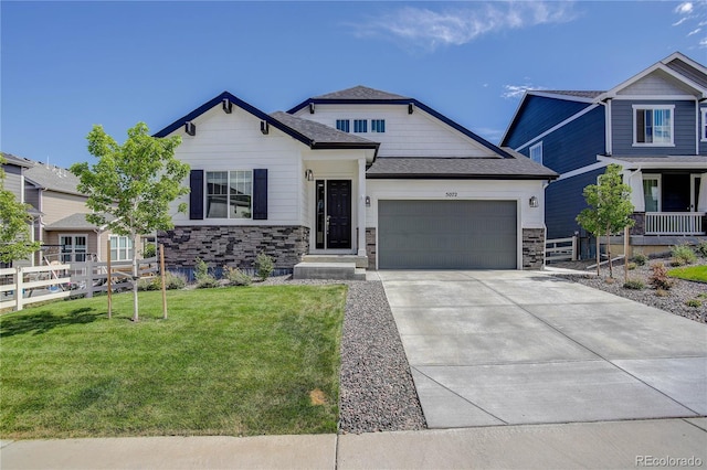 craftsman-style house with a garage and a front yard