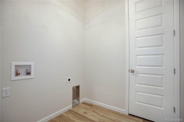 clothes washing area with washer hookup, hookup for an electric dryer, and light hardwood / wood-style floors