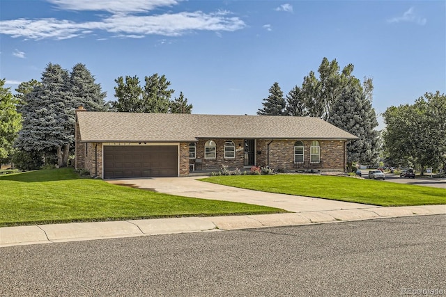 ranch-style house with a garage and a front yard