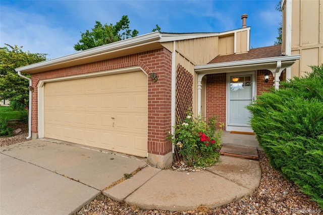 11532 Newland St, Westminster, CO 80020 - view of front of property with brick siding, a garage, and driveway