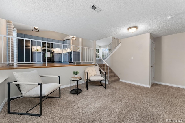 11532 Newland St, Westminster, CO 80020 - sitting room featuring carpet floors, stairs, and a textured ceiling