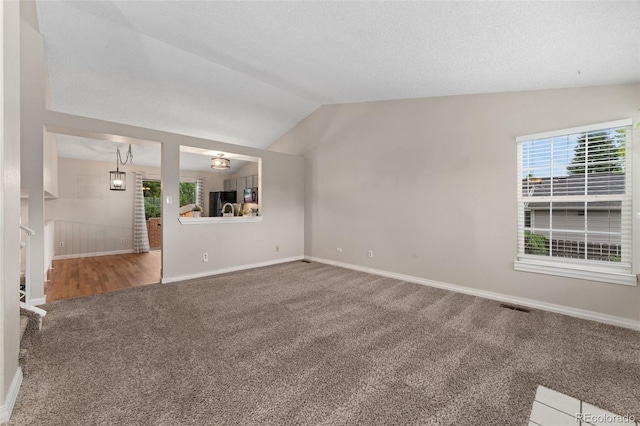 11532 Newland St, Westminster, CO 80020 - spare room with carpet flooring and vaulted ceiling