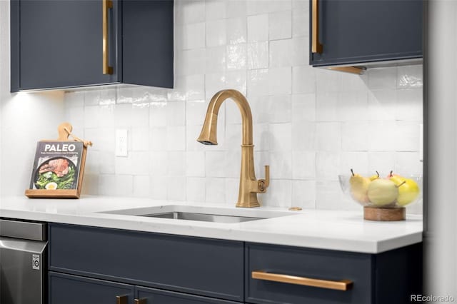 kitchen view of a sink, decorative backsplash, and light countertops