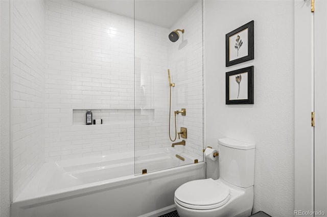 bathroom featuring toilet and tub / shower combination