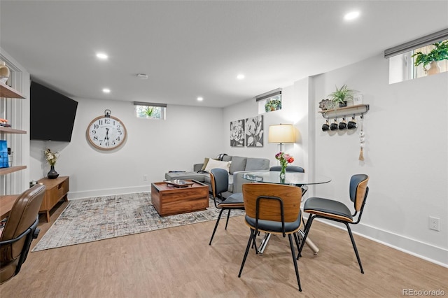 dining area featuring wood finished floors, recessed lighting, and baseboards