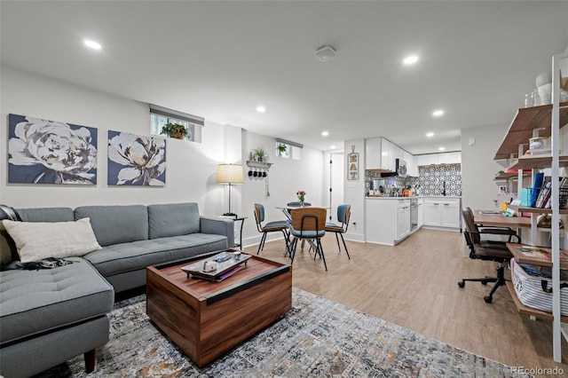 living room featuring recessed lighting and light wood finished floors