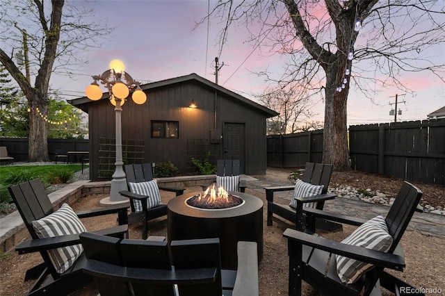 view of patio featuring a fire pit and a fenced backyard