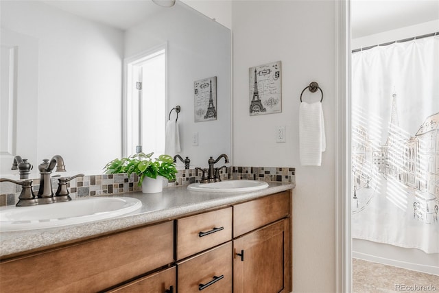 bathroom featuring vanity and shower / bath combo with shower curtain