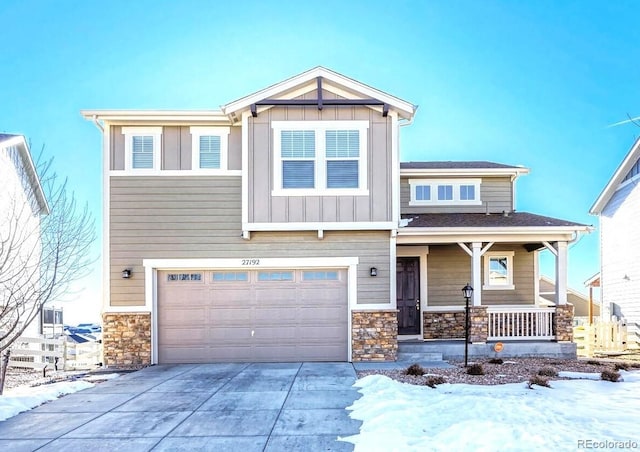 craftsman house with a porch and a garage