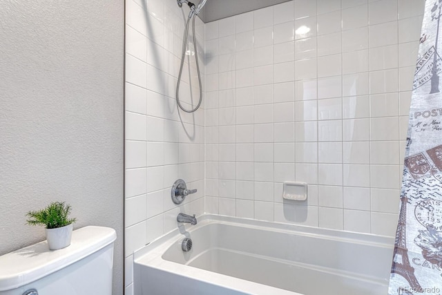 bathroom with shower / bathtub combination with curtain and toilet