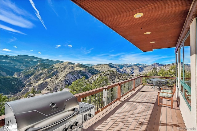 2433 Dogie Spur, Golden, CO 80403 - wooden terrace with a mountain view and area for grilling