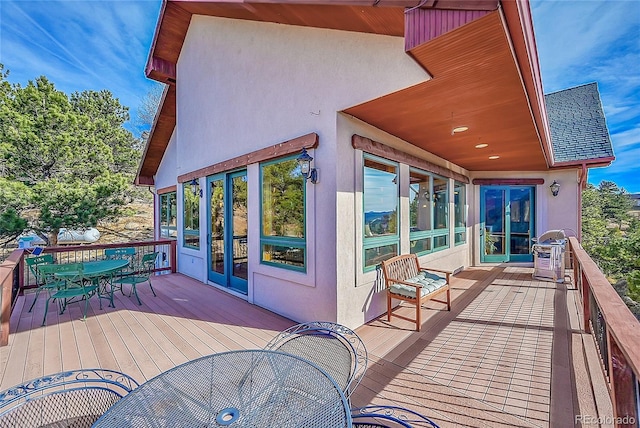2433 Dogie Spur, Golden, CO 80403 - wooden deck featuring outdoor dining space