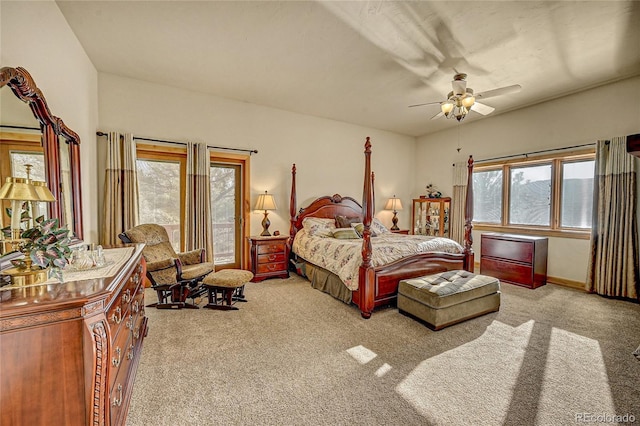 2433 Dogie Spur, Golden, CO 80403 - carpeted bedroom with multiple windows and ceiling fan