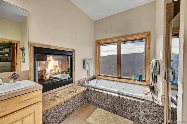 2433 Dogie Spur, Golden, CO 80403 - bathroom with vanity, a jetted tub, and tile patterned floors