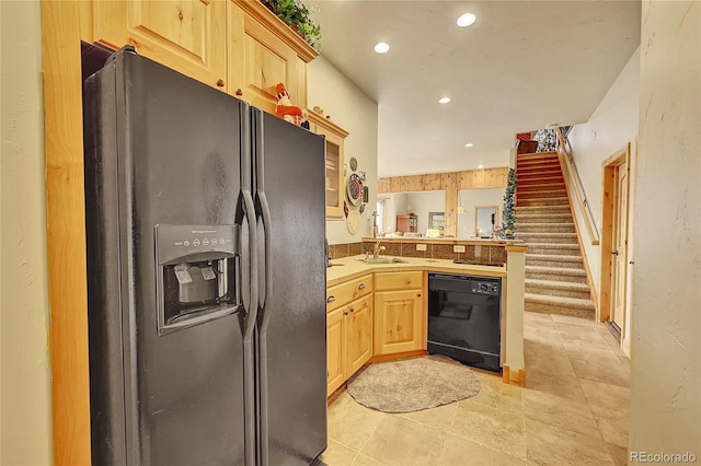 2433 Dogie Spur, Golden, CO 80403 - kitchen with black appliances, a sink, a peninsula, light brown cabinets, and recessed lighting