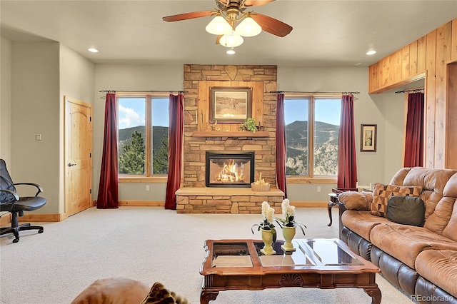 2433 Dogie Spur, Golden, CO 80403 - carpeted living area with baseboards, a mountain view, a ceiling fan, plenty of natural light, and recessed lighting