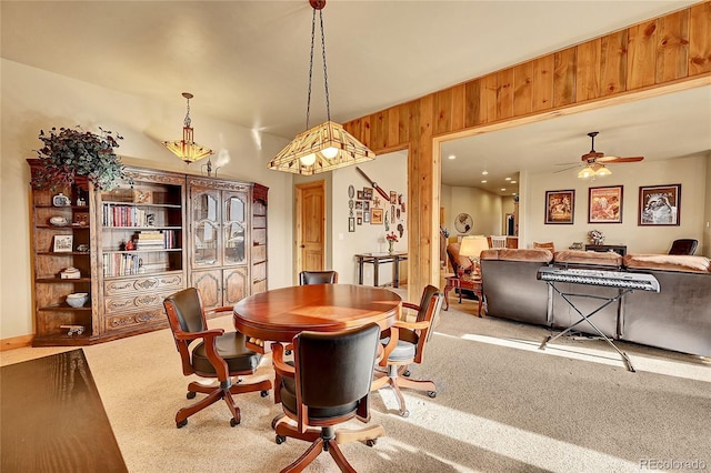 2433 Dogie Spur, Golden, CO 80403 - dining area with a ceiling fan, carpet, and wooden walls