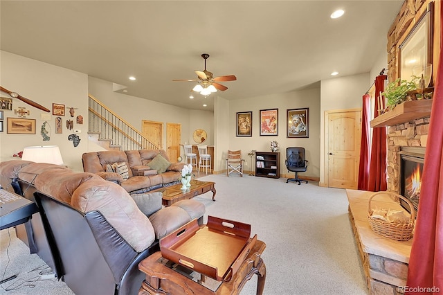 2433 Dogie Spur, Golden, CO 80403 - living room with ceiling fan, carpet, recessed lighting, a fireplace, and stairs