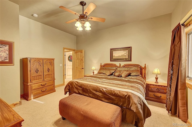 2433 Dogie Spur, Golden, CO 80403 - bedroom with light colored carpet, ceiling fan, and baseboards