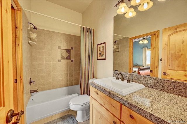 2433 Dogie Spur, Golden, CO 80403 - bathroom featuring shower / tub combo, vanity, tile patterned flooring, toilet, and a chandelier