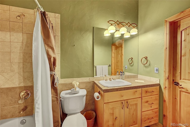 2433 Dogie Spur, Golden, CO 80403 - bathroom with vanity, shower / bath combo, and toilet