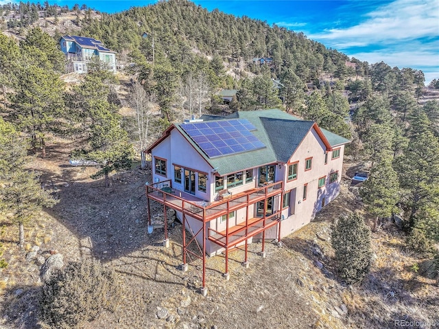 2433 Dogie Spur, Golden, CO 80403 - view of subject property featuring a forest