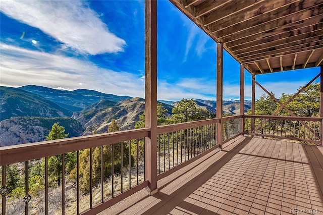 2433 Dogie Spur, Golden, CO 80403 - wooden terrace with a mountain view