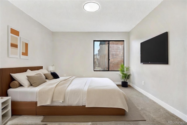 bedroom featuring light colored carpet