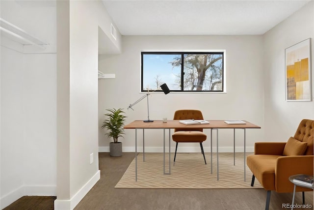 office space with dark hardwood / wood-style flooring