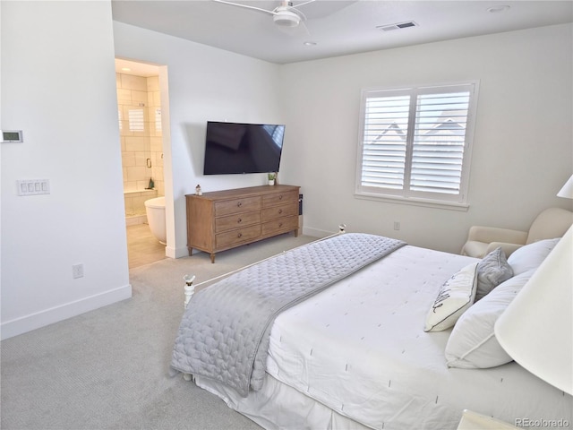 bedroom featuring ensuite bath, ceiling fan, and light colored carpet