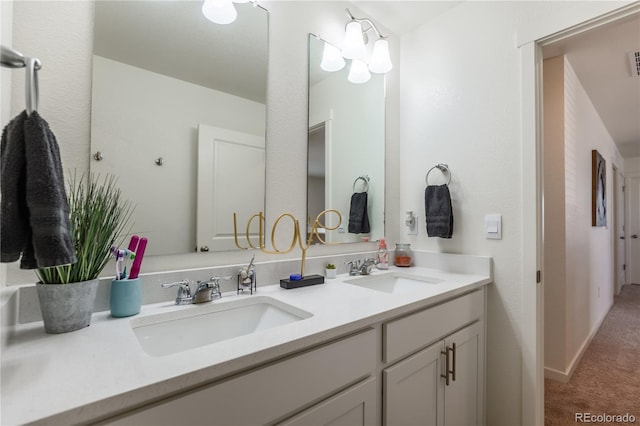 920 William Way, Brighton, CO 80603 - bathroom featuring double vanity and baseboards