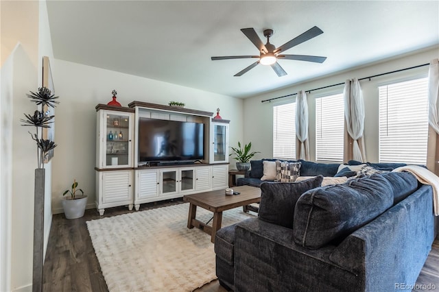920 William Way, Brighton, CO 80603 - living area featuring dark wood-style floors, a ceiling fan, and baseboards