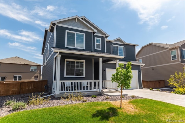 920 William Way, Brighton, CO 80603 - view of front of home featuring covered porch, driveway, and a garage