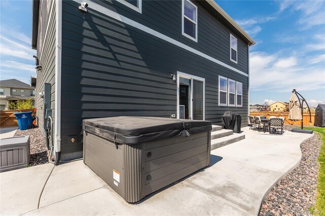 920 William Way, Brighton, CO 80603 - back of property with a hot tub and a patio area