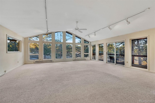 unfurnished sunroom with lofted ceiling, rail lighting, a baseboard radiator, and a ceiling fan