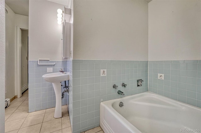 full bathroom with a garden tub, tile walls, a baseboard heating unit, wainscoting, and tile patterned flooring