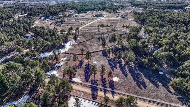 aerial view featuring a view of trees