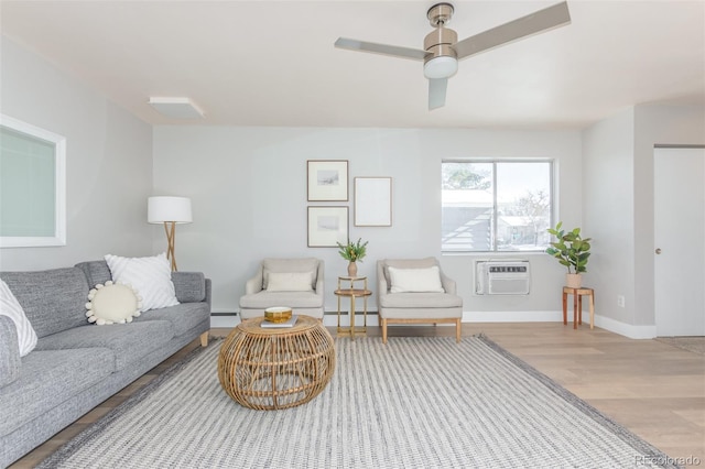 living room with a baseboard heating unit, a wall mounted AC, hardwood / wood-style floors, and ceiling fan