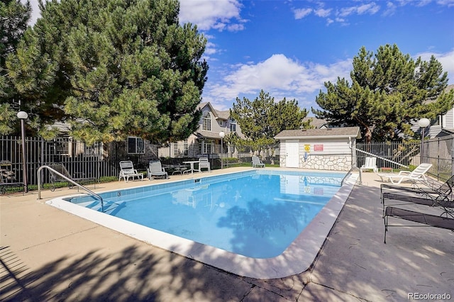 view of pool featuring a patio