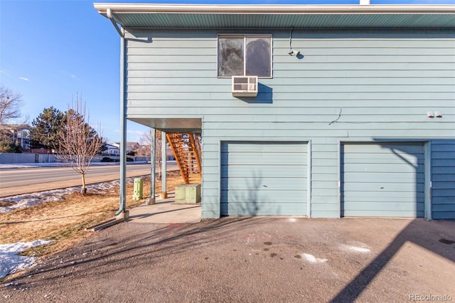 view of property exterior with a garage