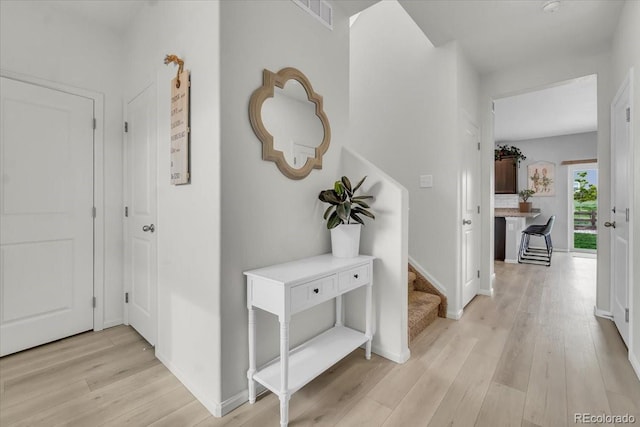 7218 Animas Ave, Frederick, CO 80530 - hall featuring light wood-style flooring, baseboards, and stairs