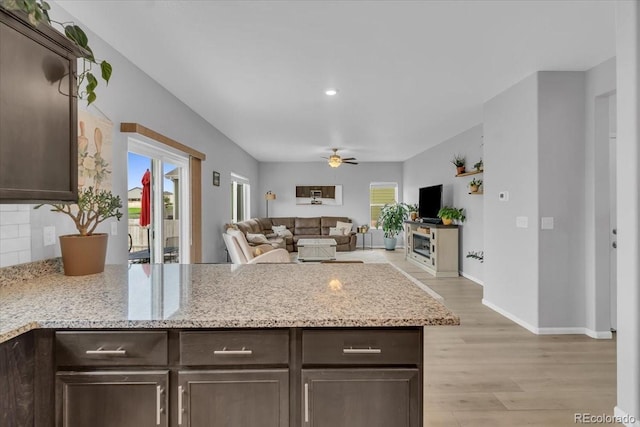 7218 Animas Ave, Frederick, CO 80530 - kitchen featuring dark brown cabinets, a peninsula, ceiling fan, light wood-style floors, and recessed lighting