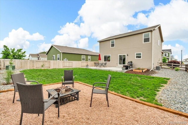 7218 Animas Ave, Frederick, CO 80530 - rear view of house featuring an outdoor fire pit and a patio area